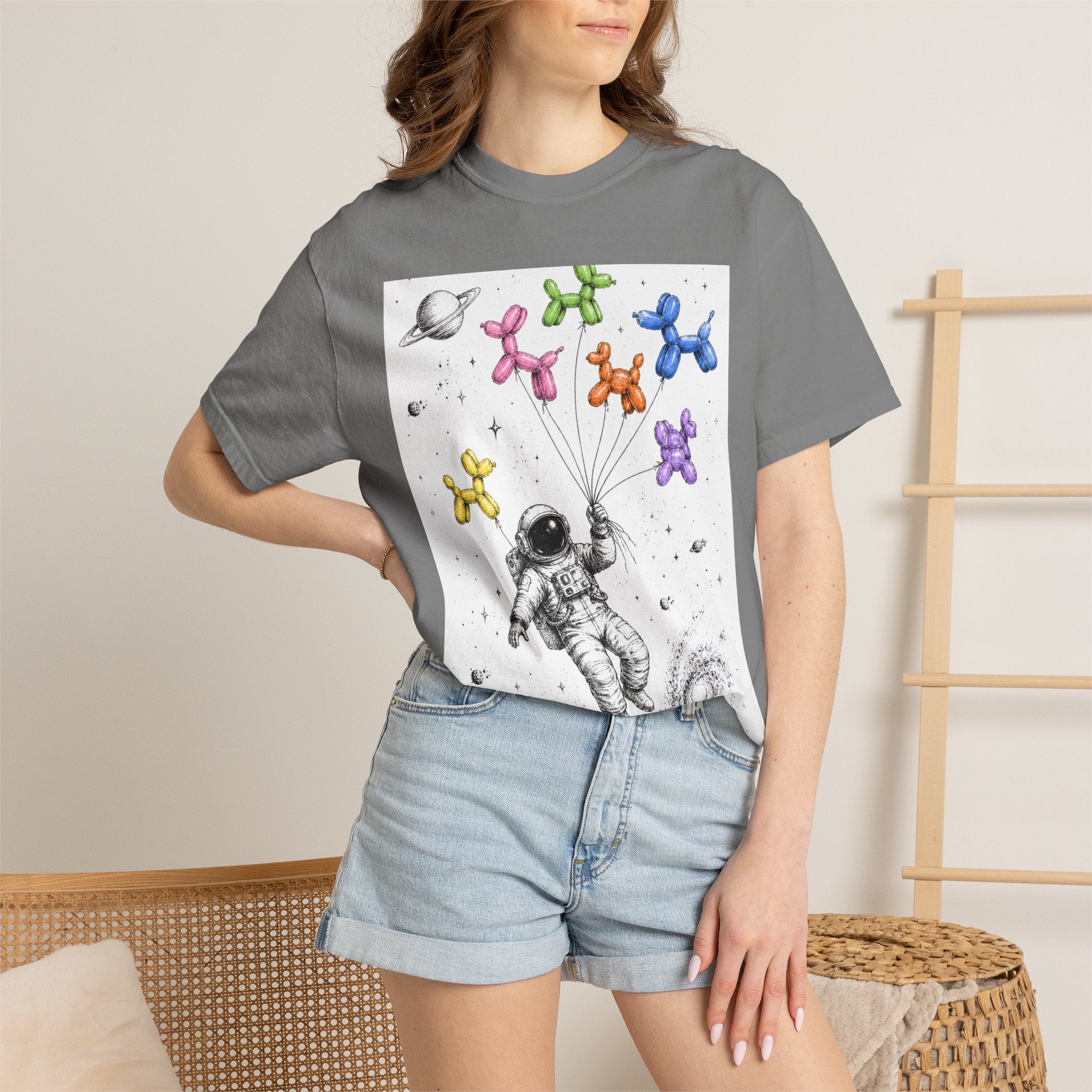 Astronaut Balloon Tee — Space Explorer with Colorful Balloon Dogs