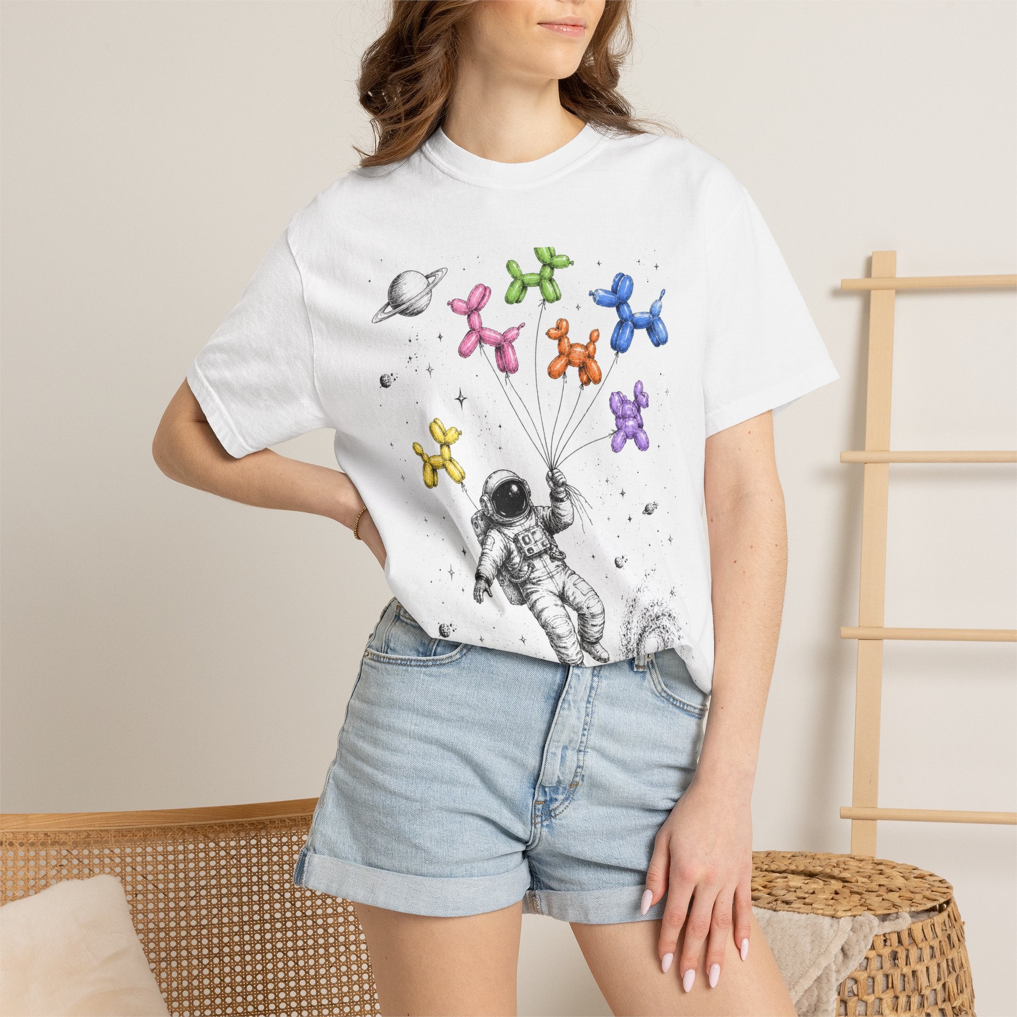 Astronaut Balloon Tee — Space Explorer with Colorful Balloon Dogs